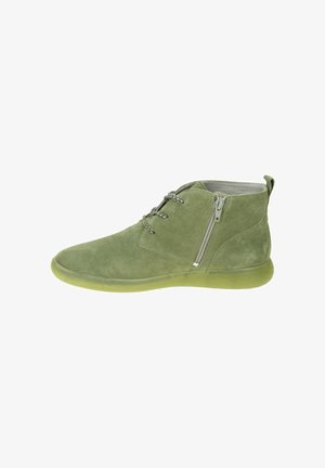 Green suede ankle boot with side zipper, round toe, lace-up front, and matching translucent sole.