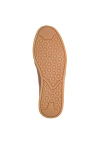 Semelle en caoutchouc de sneaker beige présentant un motif en nid d'abeille et des zones texturées. Taille indiquée comme 37.