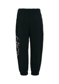 Pantalon de survêtement noir avec une taille et des poignets élastiques, présentant un détail décoratif à motif en or et argent sur le côté gauche.