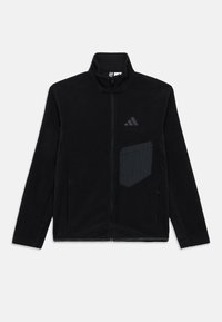 Μαύρο φλις μπουφάν με φερμουάρ και ψηλό γιακά, με τσεπάκι σε μοτίβο καρό και διακριτική λεπτομέρεια με λογότυπο στο στήθος.