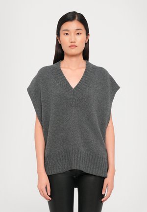 Harmaa neulottu poncho-tyylinen neulepaita, jossa on V-kaula-aukko, leveät hihat ja ribbaushelma. Pehmeä pinta ja rento malli, sopii hyvin kerrospukeutumiseen.