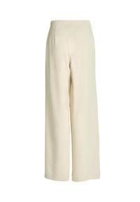 Pantalon crème taille haute à jambes larges, finition lisse et sur mesure, sans poches visibles ni ornements.