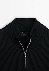 Black cotton pullover with ribbed texture, high collar, and a silver zipper front. Label reads "Massimo Dutti, 100% Cotton, Made in China."