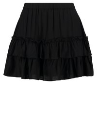 Svart kjol med lager-på-lager volangdesign, elastisk midjeband och lätt tyg som ger en flödande silhuett.