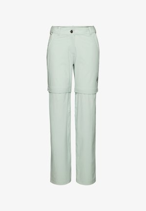 Ljust gröna konvertibla byxor med två sidfickor och knappstängning. Har en logotyp patch på sidan och ett glatt, lätt tyg.