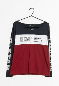 Dlouhý rukáv T-shirt s kulatým výstřihem; barevně rozčleněný v námořnické modři, bílé a burgundské. Obsahuje text "RAW DENIM" a logo "G-Star" na rukávech.