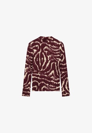 Long-sleeve top featuring a maroon and cream abstract pattern. Made of soft fabric with a fitted design and a high neckline.