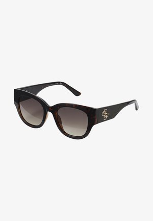 Tortoiseshell sunglasses with oversized rectangular frames, gradient lenses, and gold logo accent on the arm. Smooth plastic material.