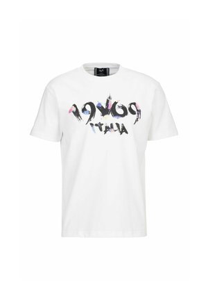 T-shirt en coton blanc avec un imprimé graphique représentant "1969 Italia" en noir et des accents colorés. Encolure ronde classique et manches courtes.