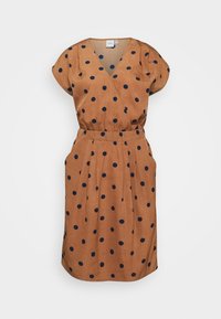 Ruskea mekko tummansinisillä pilkuilla, kietaisumalli, lyhyet hihat, gathers vyötäröllä ja polven pituinen helma. Sileä kankaan tekstuuri.