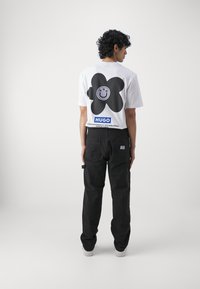 HUGO GIORO - Cargobroek - black
