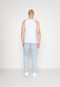 Levi's® 511 SLIM - Calças de ganga de perna direita - light indigo worn in