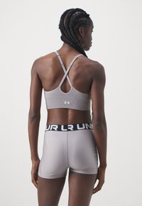 Under Armour VANISH SEAMLESS LOW - Sujetadores deportivos con sujeción ligera - tetra gray/white