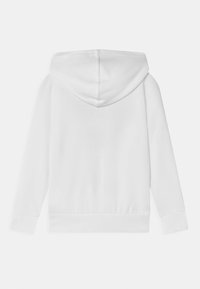 Felpa bianca con cappuccio, maniche lunghe, polsini e fondo a costine. Tessuto morbido con un design minimalista, dotata di un cappuccio arrotondato sul retro.