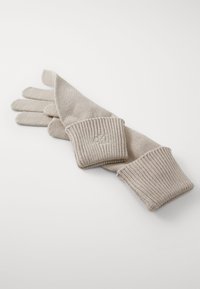 Gants en tricot marron avec des poignets en côtes et un détail de logo au poignet. Le tissu a une texture lisse, adaptée aux temps froids.