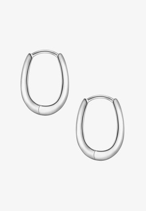 Orecchini a cerchio in argento con un design arrotondato e liscio. Forma leggermente curvata e finitura lucida. Il dettaglio delle cuciture aggiunge interesse visivo.