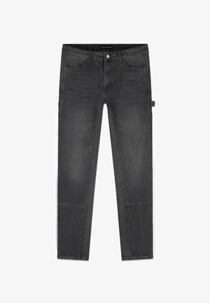 Zwarte slim-fit jeans met voorzakken en een muntzakje, een knoopsluiting, ceintuurlussen en een utiliteitslus aan de rechterpijp.