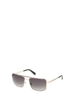 Zonnebril met een metallic zilveren frame, vierkante vorm, gradient donkere lenzen en groene accenten op de armen; gestructureerde details op de pootjes.