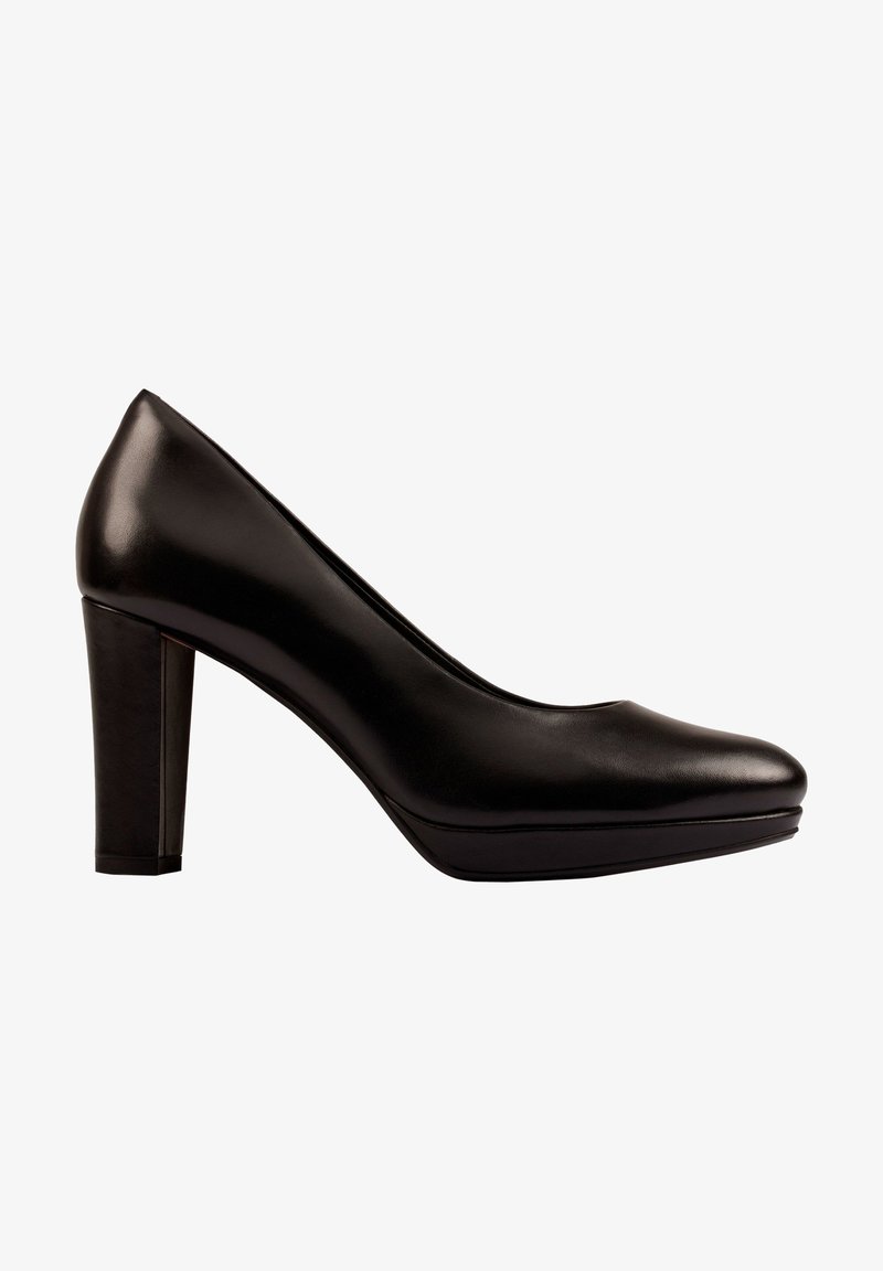 Escarpin pour femmes en cuir noir avec talon haut, bout arrondi et talon bloc sur un fond blanc.
