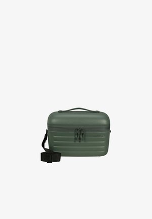 Étui rigide vert avec un design en relief texturé, doté d'une poignée supérieure et d'une sangle noire amovible. Fermeture éclair sécurisée et matériel minimal.
