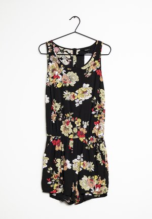 Schwarzer Blumensprunganzug mit bunten Blumenmustern, ärmellosem Design, elastischem Bund und Shorts. Hängt an einem schwarzen Kleiderbügel.