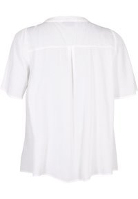Blouse blanche à manches courtes avec un motif texturé subtil, un pli au dos et une coupe ample et décontractée.