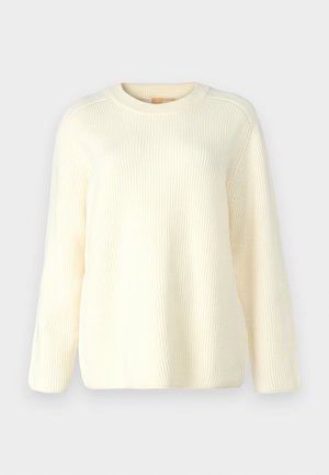 Maglione a coste color crema con colletto rotondo, maniche lunghe e vestibilità rilassata. Texture morbida con linee orizzontali in tutto il capo.