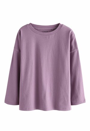 Light purple long-sleeve top made from cotton. Features a round neckline and relaxed fit with dropped shoulders. Smooth texture, no patterns.