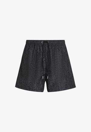 Short de bain noir avec une ceinture élastique et un cordon, présentant un motif abstrait subtil sur toute la surface du tissu.