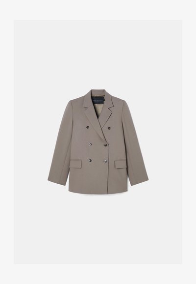 Blazer bege de dupla face com lapelas estruturadas, dois bolsos frontais e seis botões pretos, feito de um tecido liso e texturizado.