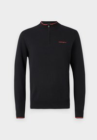 Suéter negro de manga larga con un cuello alto, que presenta un cierre de cremallera, acentos rojos en el cuello y los puños, y un logotipo minimalista en el pecho.