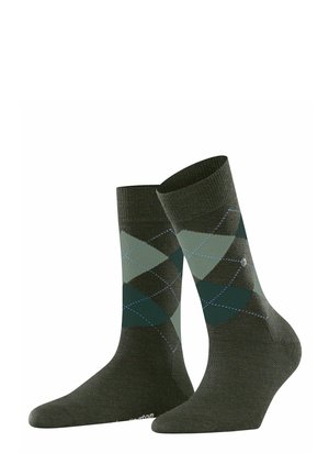 Calzini verdi con un motivo argyle in diverse tonalità di verde scuro e verde chiaro. Realizzati in tessuto con una fascia a coste e punta rinforzata.