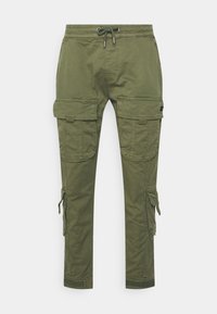 Cargo byxor i olivgrön bomull. Har elastisk midja med dragsko, sidofickor för cargo och ankle cuffs med kardborre.