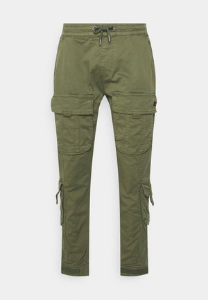 Cargo-Hosen aus olivgrüner Baumwolle. Sie verfügen über einen elastischen Taillengummi mit Kordelzug, seitliche Cargo-Taschen und Knöchelriegel mit Klettverschluss.
