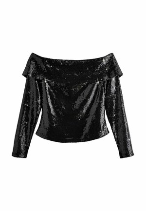 Obojczyk i szyja osoby noszącej czarny, cekinowy top z odkrytymi ramionami i geometryczną zielono-złotą kolczyk po jednej stronie.