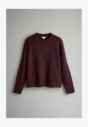 Bordeauxfarbener Pullover mit rundem Ausschnitt, langen Ärmeln und weichem, strukturiertem Strick. Verfügt über eine lockere Passform und einen Saum, der auf Taillenhöhe endet.