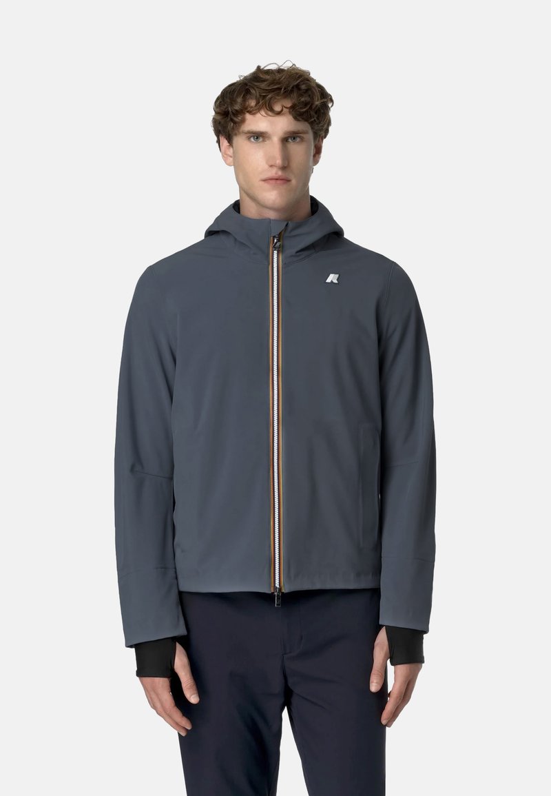 Męska szara kurtka wykonana z gładkiego, wodoodpornego materiału. Posiada kaptur, przedni zamek błyskawiczny z wielokolorowymi akcentami oraz elastyczne mankiety.