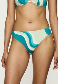 Dół bikini w faliste wzory w kolorze teal i kremowym. Miękki materiał, średni stan i gładkie krawędzie. Zaprojektowany z myślą o komforcie i dopasowaniu.