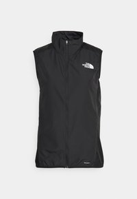 Svart ärmlös väst i vindtåligt material, med hög krage, full dragkedja och vitt logotyp på vänster bröst. Slät yta.