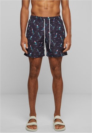 Marineblaue Badeshorts mit einem Segelbootmuster, elastischem Bund, weißen Kordeln und kontrastierenden, mehrfarbigen Details. Hergestellt aus leichtem Material.