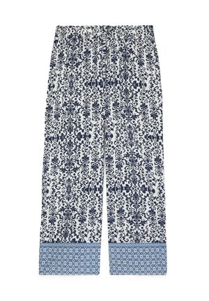 Białe spodnie z granatowymi kwiatowymi i winoroślowymi wzorami, ze ściągaczem o niebieskim geometrycznym wzorze i elastycznym pasem.