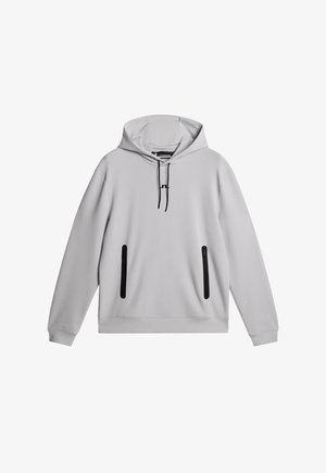 Grå huvtröja med svarta detaljer, utrustad med en framficka i kängurustil och två fickor med dragkedja på sidan. Tillverkad av ett mjukt material.