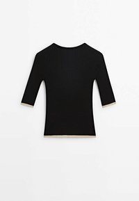 Top in maglia a coste nera con maniche a tre quarti e rifiniture color crema all'orlo e alle maniche. Tessuto liscio, design aderente.