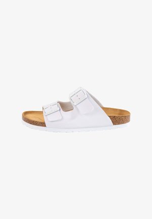White two-buckle sandal with a cork footbed and a textured pattern. The sole is white rubber, offering a lightweight and comfortable design.