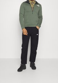The North Face Ulkohousut - black