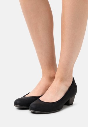 Bottines noires texturées avec un bout rond et un petit talon. Le design présente un col lisse et une semelle en caoutchouc pour une bonne adhérence.