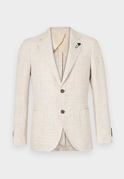 Beige textured blazer with notched lapels, two brown buttons, and side pockets. Features a black lapel pin and cream-colored inner lining.