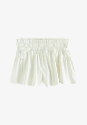 White elastic waist shorts with gathered fabric and a loose, flowy fit.