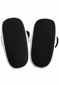 Black sole with textured grip, surrounded by a white fabric edge, featuring rounded shape and smooth upper, designed for indoor use.