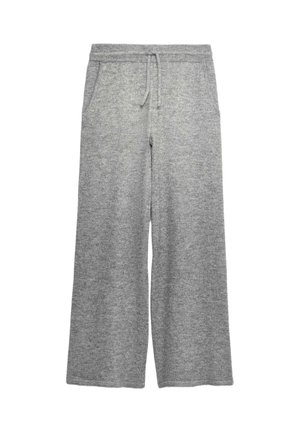 Pantalon large en maille gris clair avec taille élastique et cordon de serrage, doté de poches latérales.